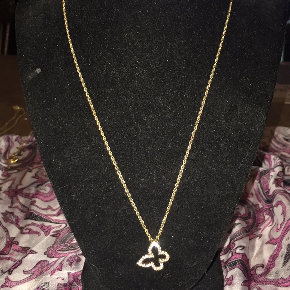 Chain is Avon and charm is 14k over 925